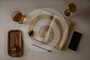 Open Bible Surrounded By Objects 