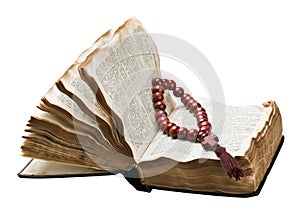 Open bible and wooden rosary