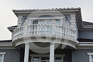 Open big  white concrete balcony with door and windows