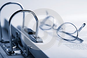 Open binder and glasses