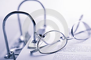 Open binder and glasses