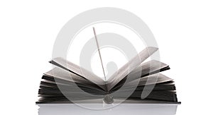 Open black book on white background