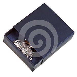 Open black gift box with golden chainlet