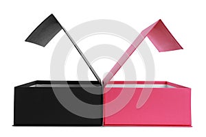 Open black and pink shoe boxes on white background