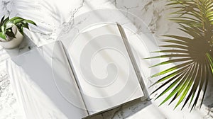 Open Blank Book on Marble with Tropical Plant Shadows