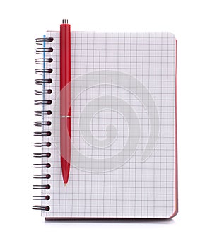 Open blank checked notebook with red pen