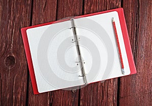 Open blank notepad with a pencil