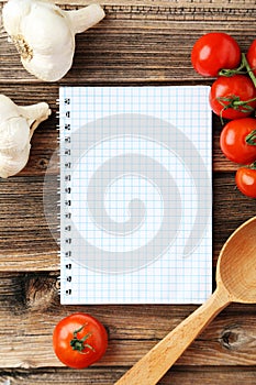 Open blank recipe book on the brown wooden background