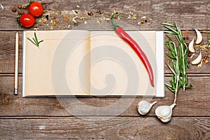 Open blank recipe book on brown wooden background