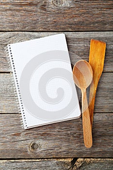 Open blank recipe book on grey wooden background