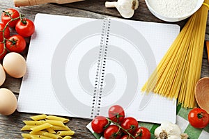 Open blank recipe book on grey wooden background