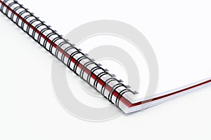 Open blank spiral notebook on white background