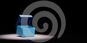 Open Blue Box Spotlighted on Black Background photo