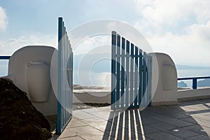 Open blue door overlooking the Mediterranean sea