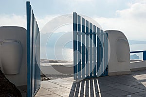 Open blue door overlooking the Mediterranean sea