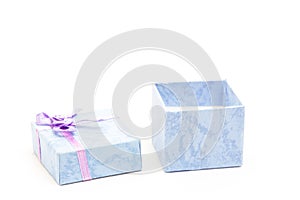 Open blue gift box with purple ribbon