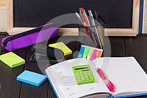 Open book on blackboard