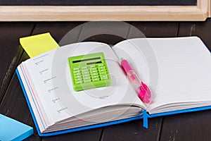 Open book on blackboard