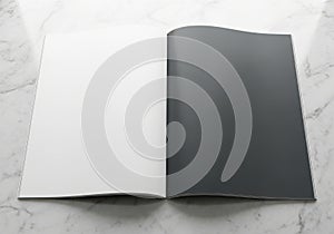 Open book with blank white and dark pages on a textured surface