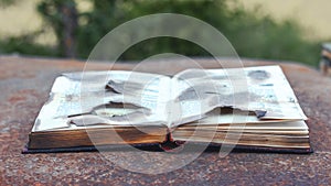 An open book with burnt pages after a fire