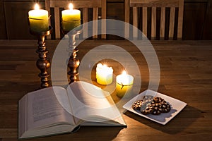 Open book and candles