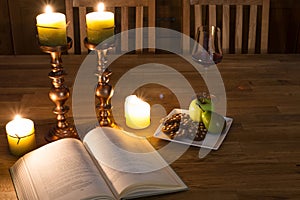 Open book and candles