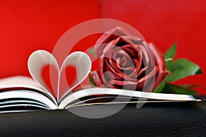 Open book with curved pages in a heart shape photo