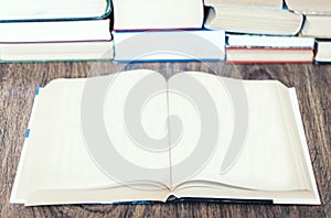 Open book with empty page and stack of old book education concept background, with copy space for text