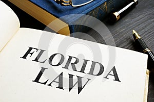 Open book with Florida law on a desk