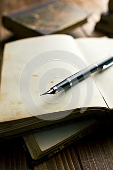 Open book with fountain pen