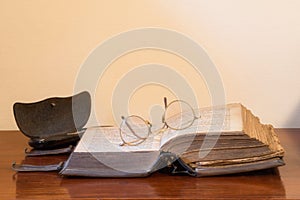 Open book with glasses