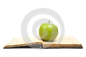 Open Book and green apple