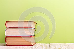 Open book on green wooden background. Education concept. Copy space for ad