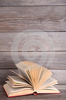 Open book on a grey wooden table