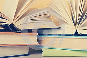 Open book, hardback books on wooden table. Education concept. Back to school.