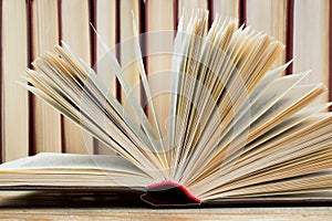 Open book, hardback books on wooden table. wooden background. Back to school. Education. Copy space for text