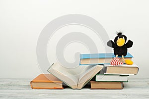 Open book, hardback colorful books on wooden table. Back to school. Copy space for text. Education business concept