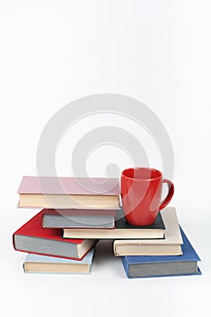 Open book, hardback colorful books on wooden table, white background. Back to school. Copy space for text. Education