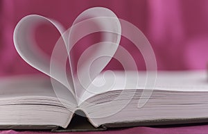 Open book with heart shape
