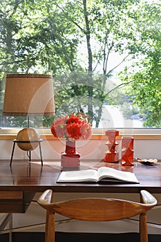 Open Book, Lamp And Retro Ornaments On Desk