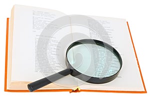 Open book and magnifier on a white background