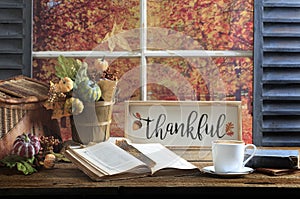 Thankful Sign, Book and Coffee Old Wood Tabletop photo