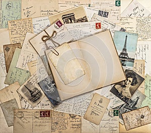 Open book, old letters and postcards. Travel memories scrapbook