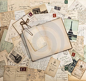 Open book, old letters and postcards. Travel scrapbook France Pa