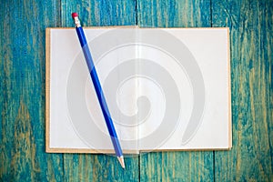 Open book and pencil