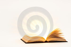 An open book that radiates light. Space for text.