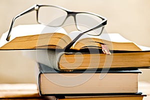 Open book with reading glasses