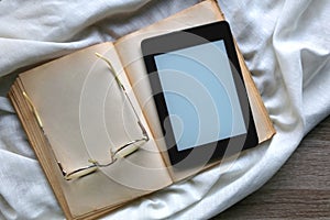 Open Book, Reading Glasses and E-Reader