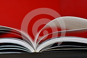 Open book on red background