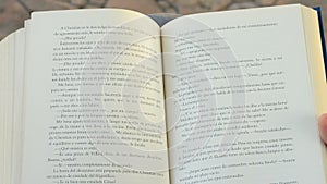 Open book in Spanish or Castilian in a park